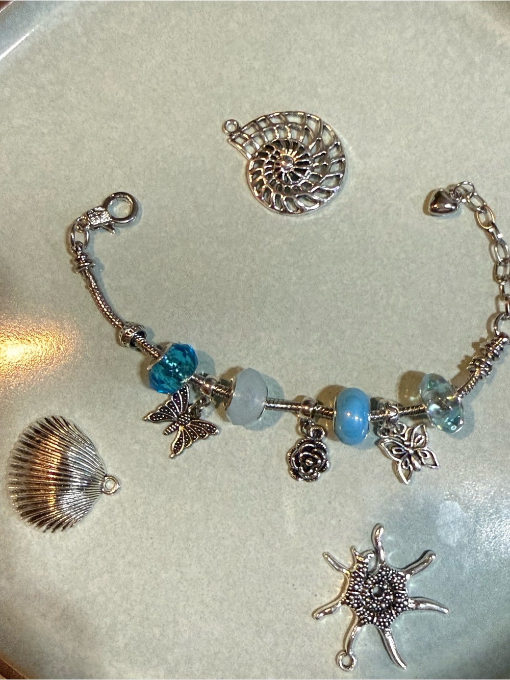 Silver-Tone Blue Charm Bracelet with Butterfly & Rose Accents